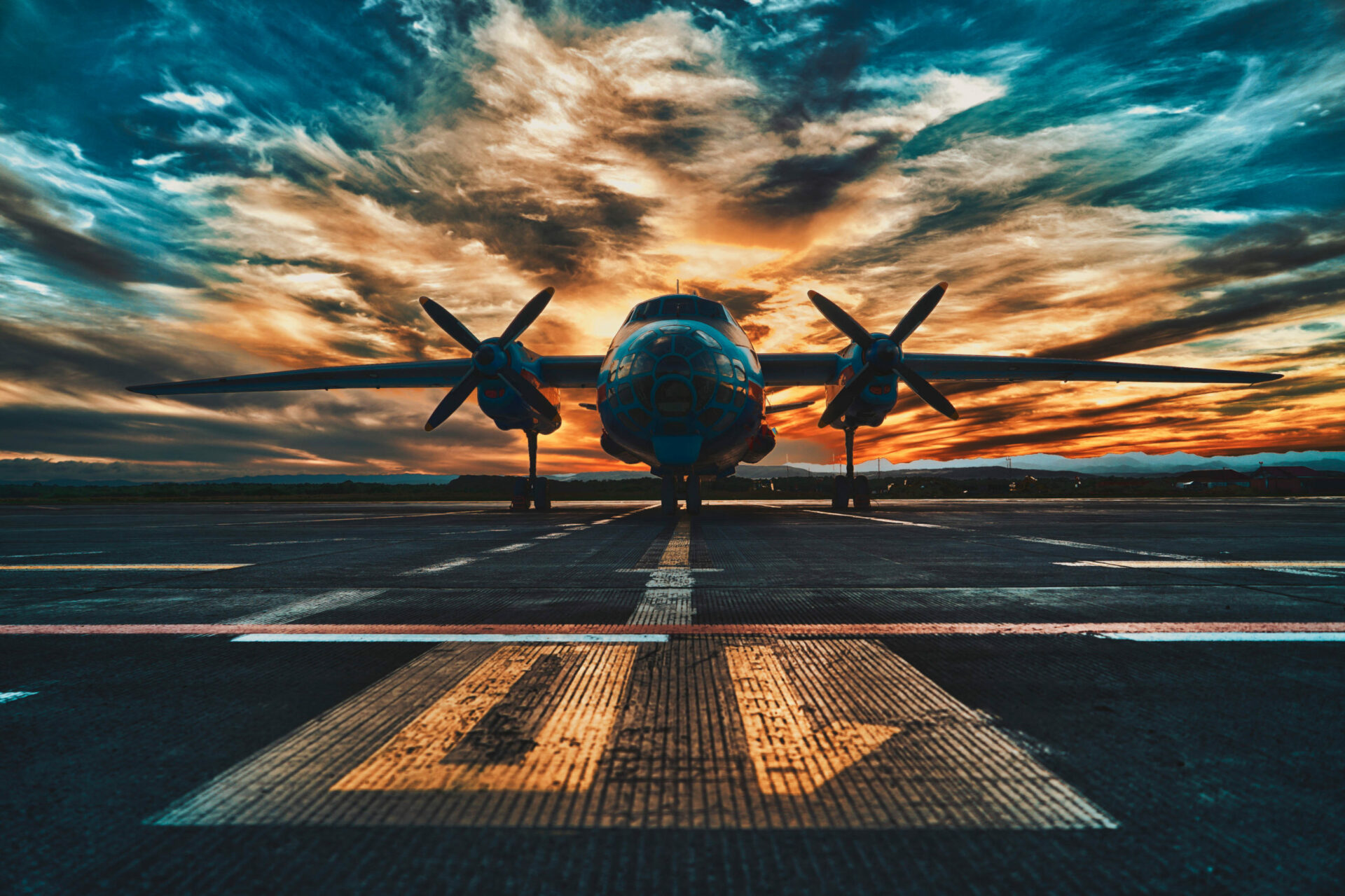 Airplane at sunrise on runway